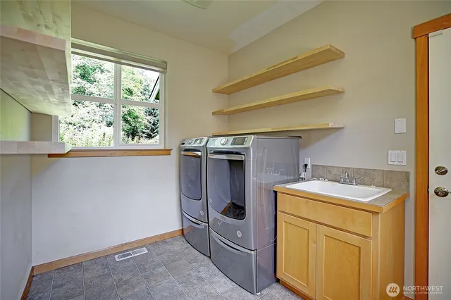 a utility room with dryer and washer