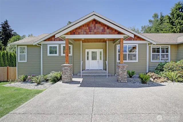 a front view of a house with garden