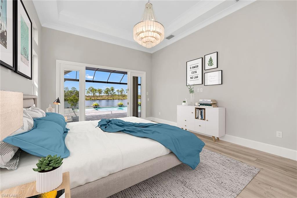 8871 Nevis Way Naples, FL 34112 - Photo 13 of 50 a spacious bedroom with a bed a dresser and next to a window