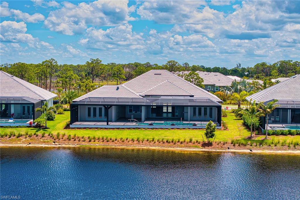8871 Nevis Way Naples, FL 34112 - Photo 30 of 50 an aerial view of a house with swimming pool and outdoor seating