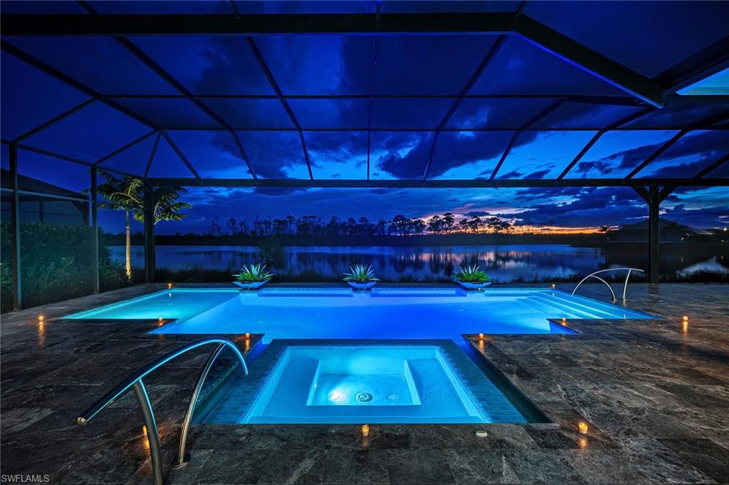 8871 Nevis Way Naples, FL 34112 - Photo 5 of 50 a view of a swimming pool with outdoor seating