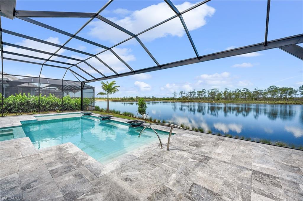 8871 Nevis Way Naples, FL 34112 - Photo 7 of 50 a view of a lake with a swimming pool