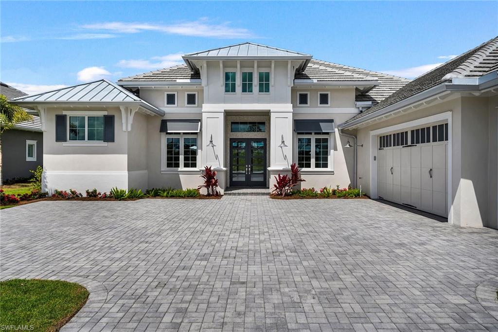 8871 Nevis Way Naples, FL 34112 - Photo 9 of 50 a front view of a house with yard