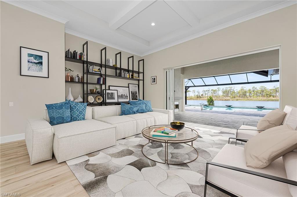 8871 Nevis Way Naples, FL 34112 - Photo 10 of 50 a living room with furniture and a wooden floor