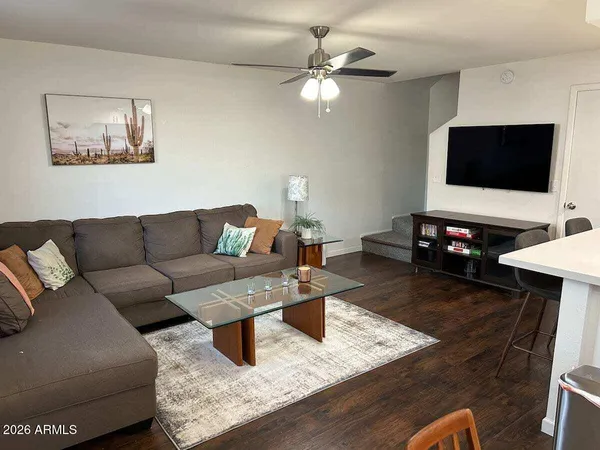 a living room with furniture and a flat screen tv