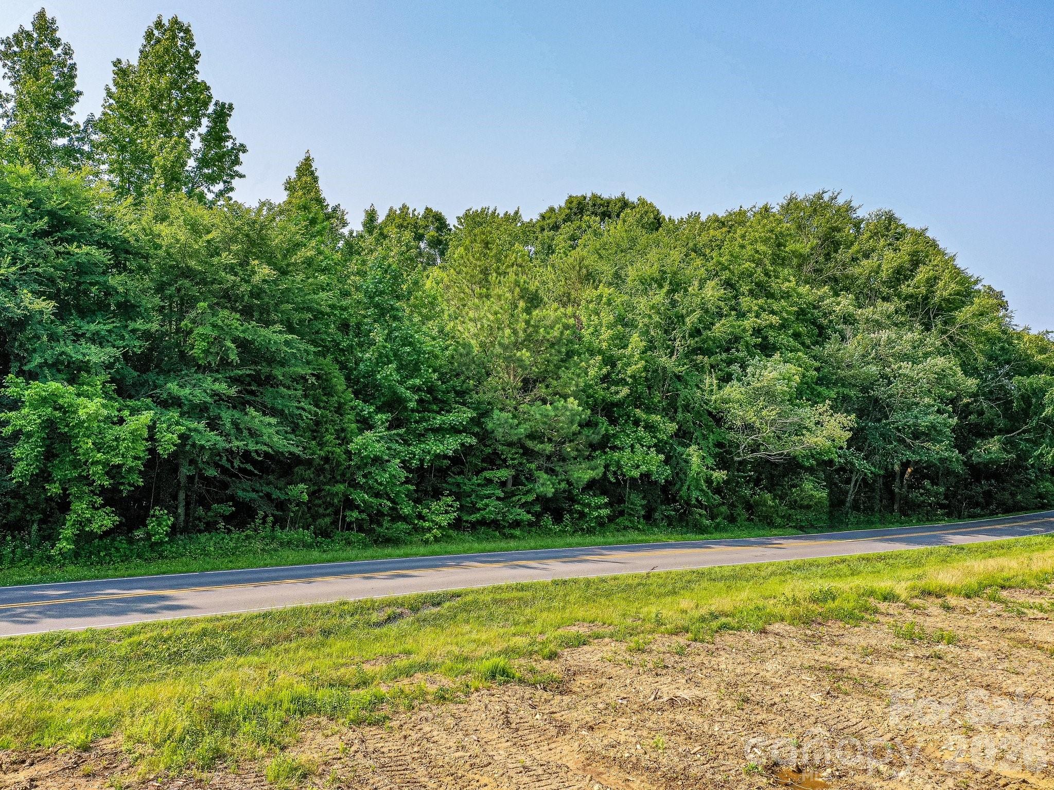 1115 Unionville - Indian Trail Road West, Unit 1 Monroe, NC 28110 - Photo 2 of 4 a view of a swimming pool with an outdoor space and seating area