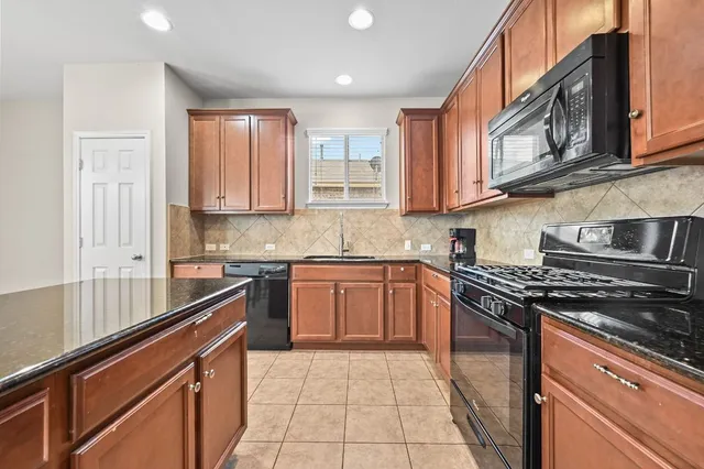 a view of a room with chandelier fan and windows