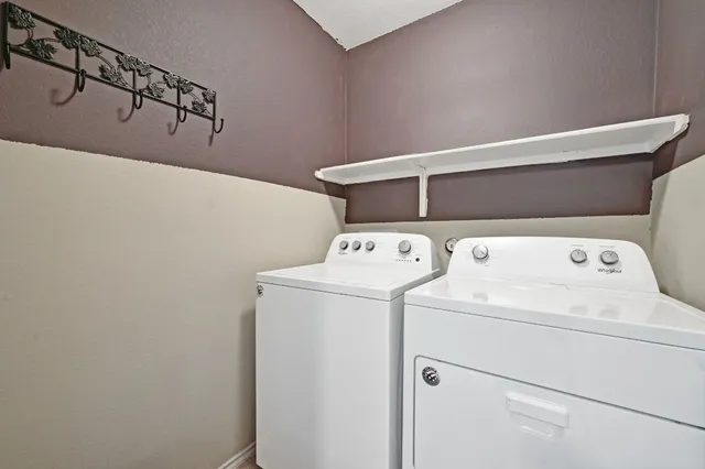 a view of backyard with wooden fence