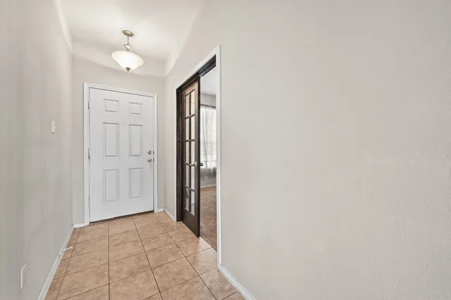 a view of a livingroom with furniture and a chandelier