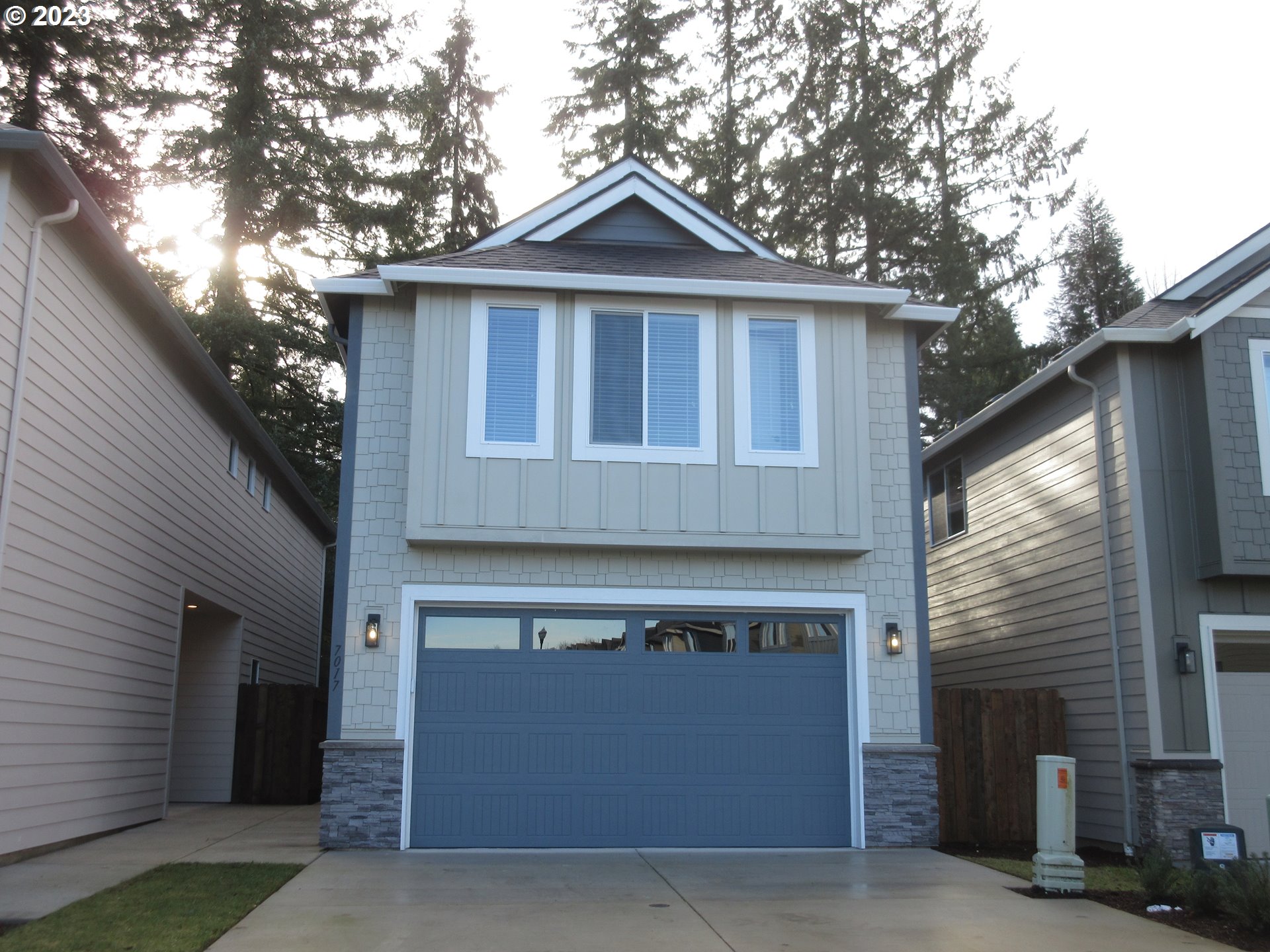 7017 South 13th Street Ridgefield, WA 98642 - Photo 1 of 33 a front view of a house with a garden