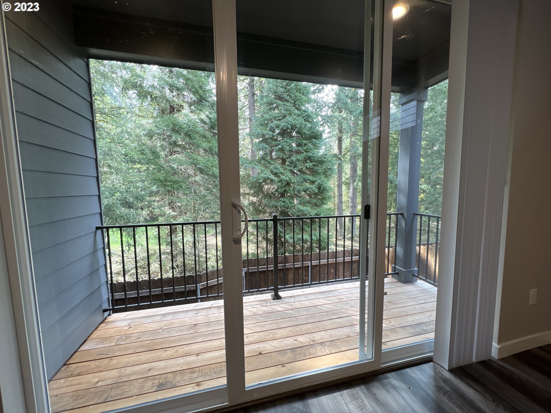 7017 South 13th Street Ridgefield, WA 98642 - Photo 11 of 33 a view of room with wooden floor and outdoor space