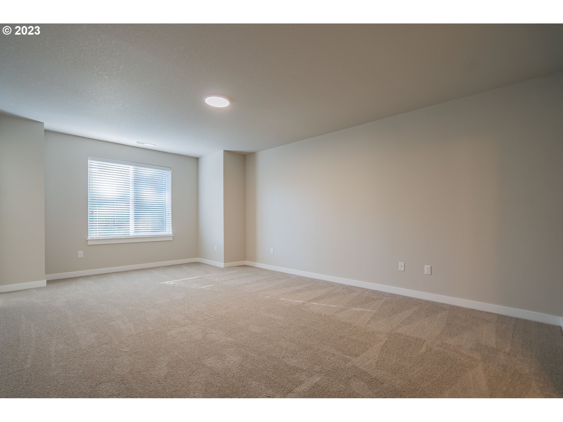 7017 South 13th Street Ridgefield, WA 98642 - Photo 12 of 33 a view of an empty room with windows