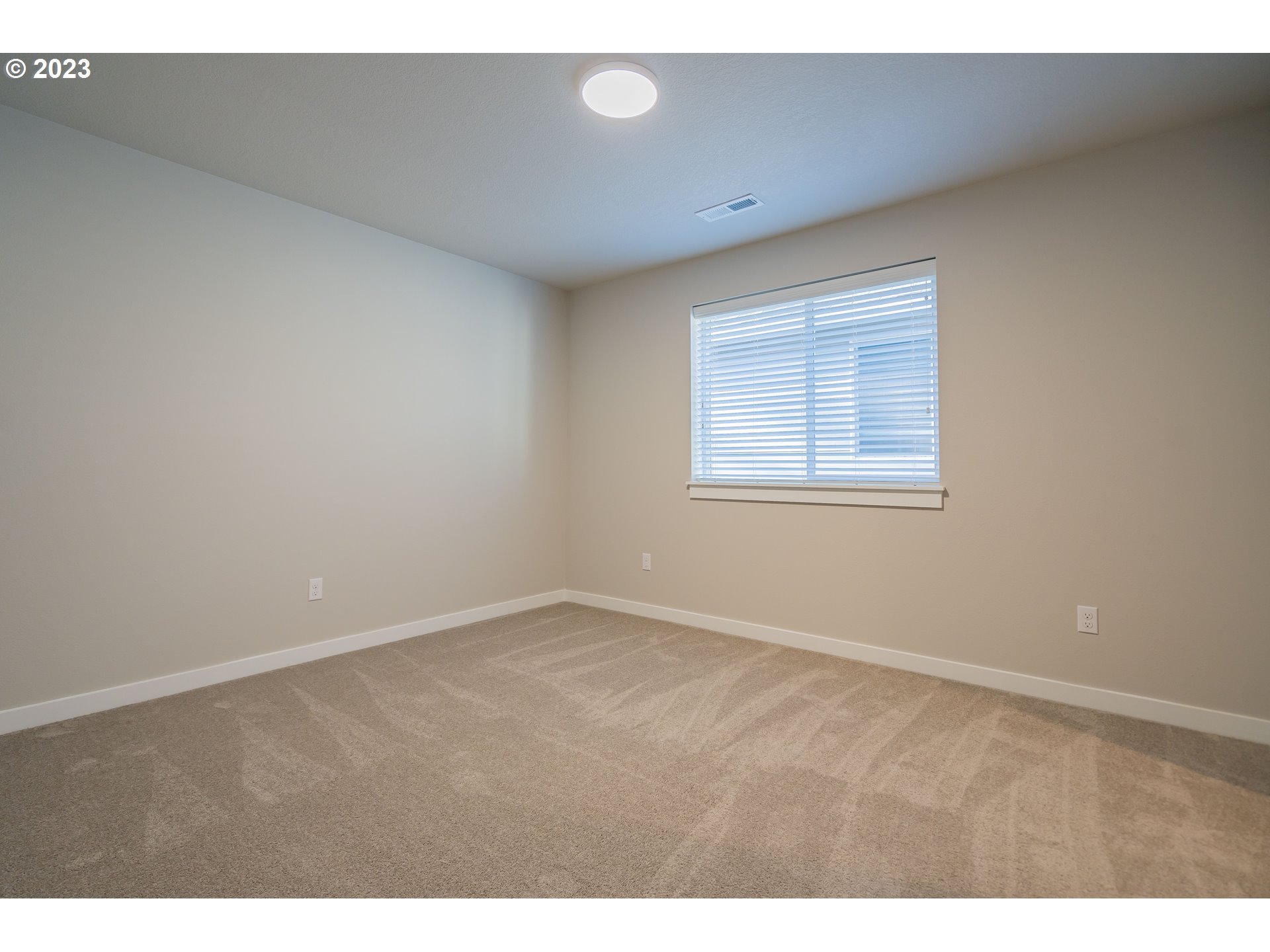 7017 South 13th Street Ridgefield, WA 98642 - Photo 21 of 33 a view of an empty room with a window