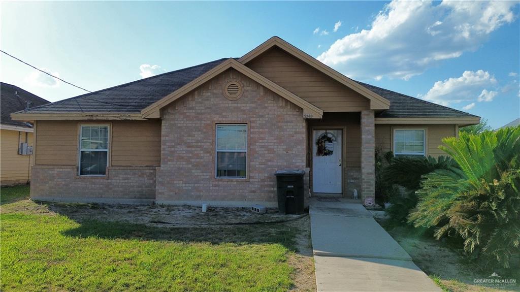 3249 J M Escobar Street Roma, TX 78584 - Photo 1 of 1 View of front of house featuring a front yard