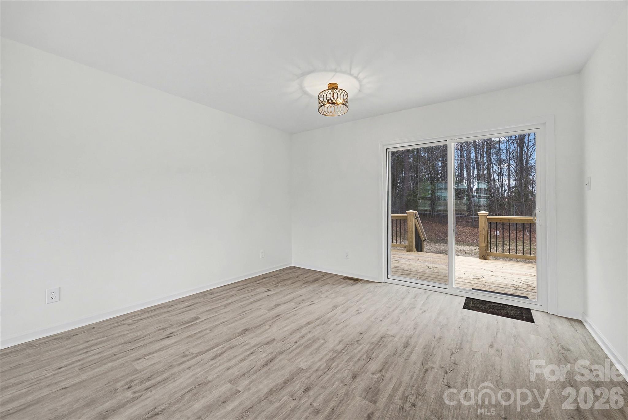 1135 Princeton Road Rock Hill, SC 29730 - Photo 4 of 20 wooden floor in an empty room with a window