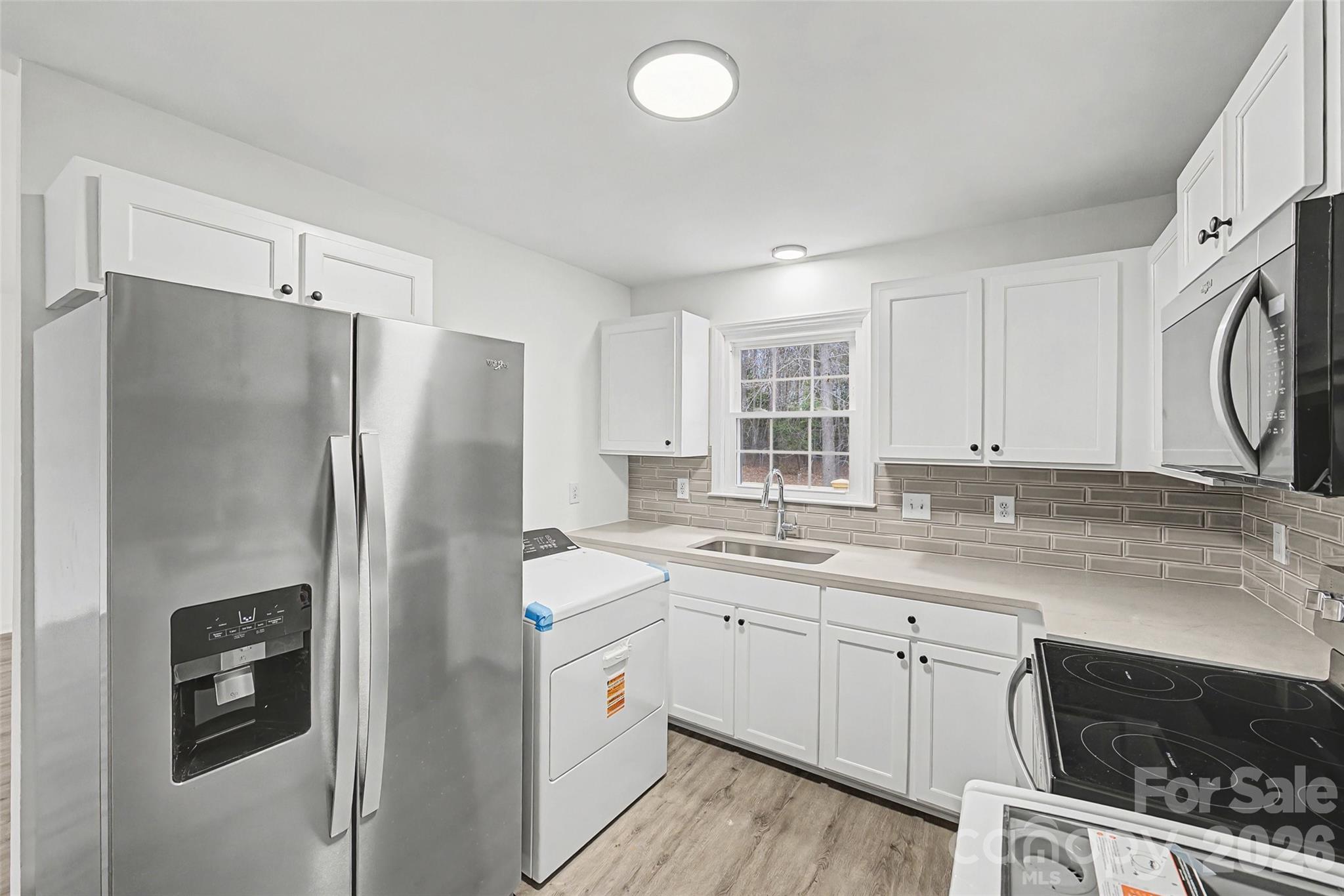 1135 Princeton Road Rock Hill, SC 29730 - Photo 5 of 20 a kitchen with a sink a refrigerator and a stove
