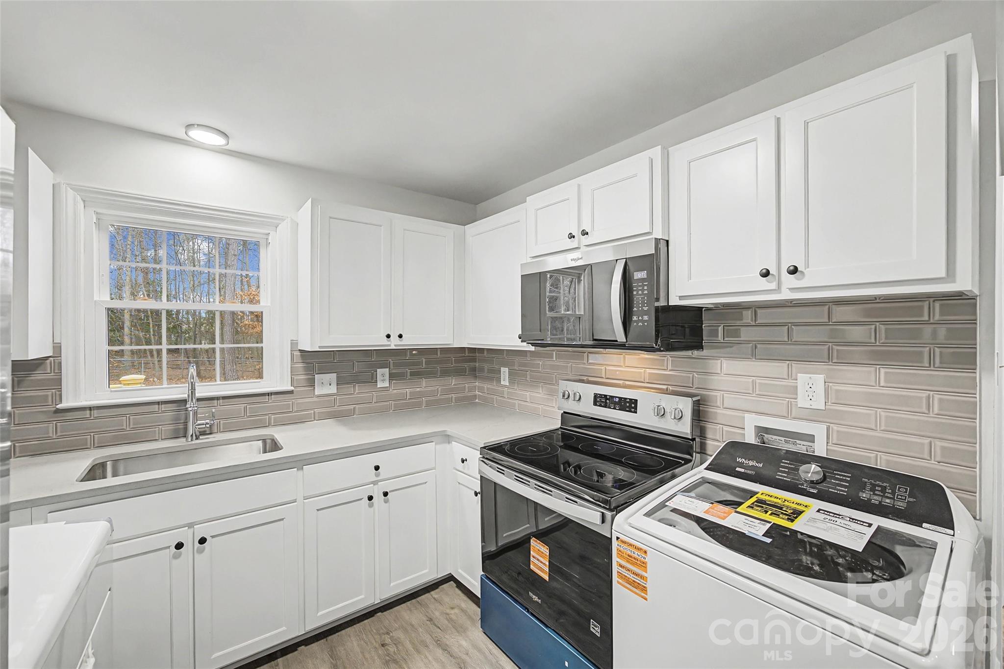 1135 Princeton Road Rock Hill, SC 29730 - Photo 6 of 20 a stove top oven sitting inside of a kitchen