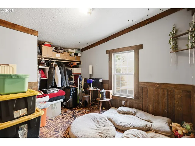 a bed room with a bed and a window