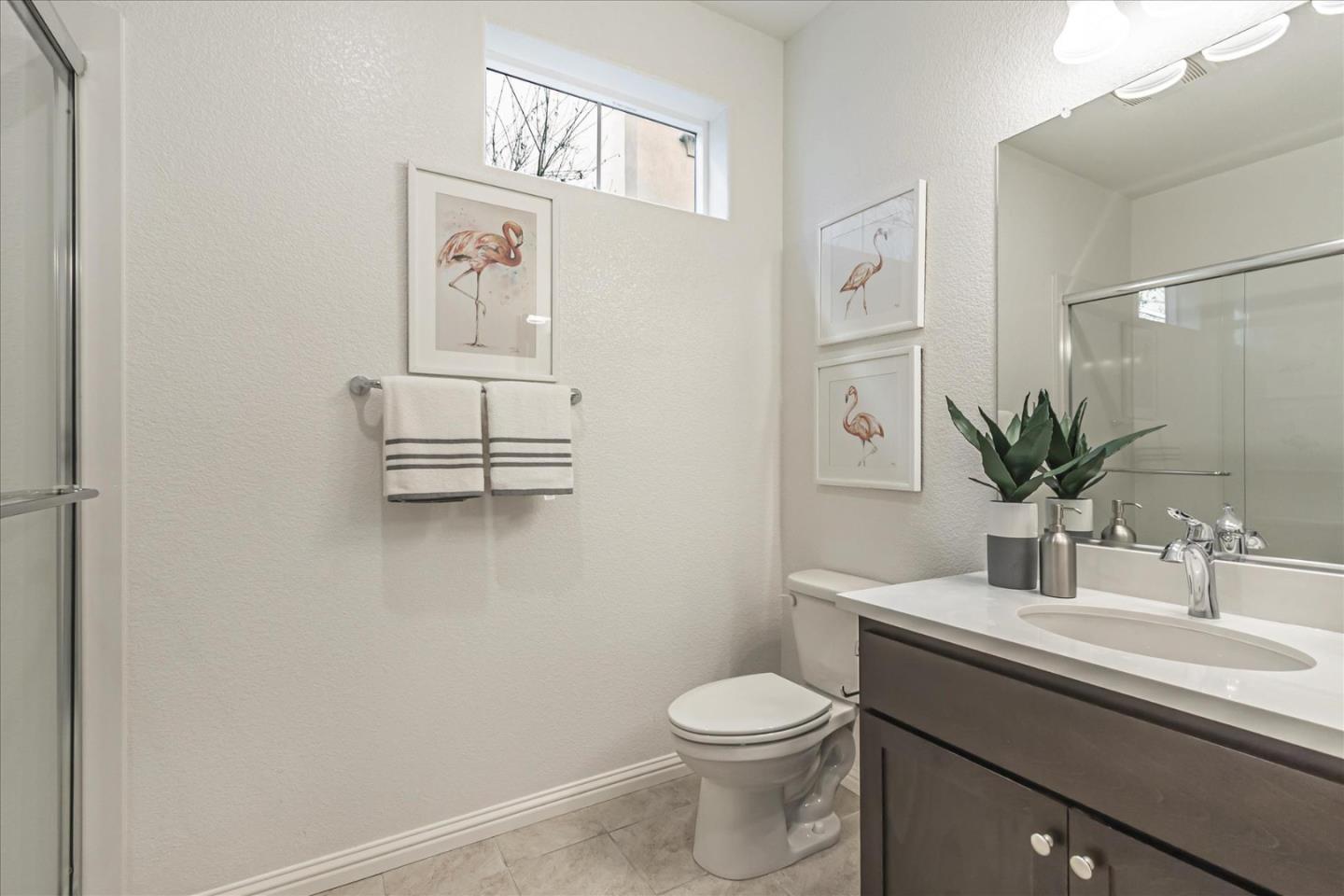 37366 Sequoia Road Fremont, CA 94536 - Photo 13 of 32 a bathroom with a toilet sink and mirror