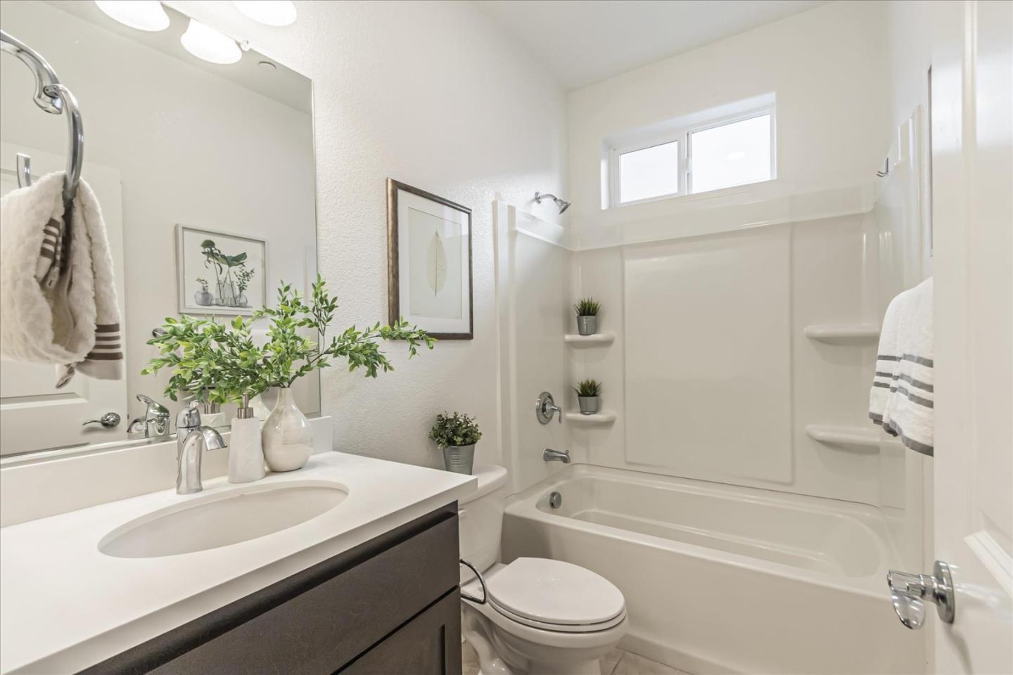37366 Sequoia Road Fremont, CA 94536 - Photo 16 of 32 a bathroom with a sink a toilet a tub and shower