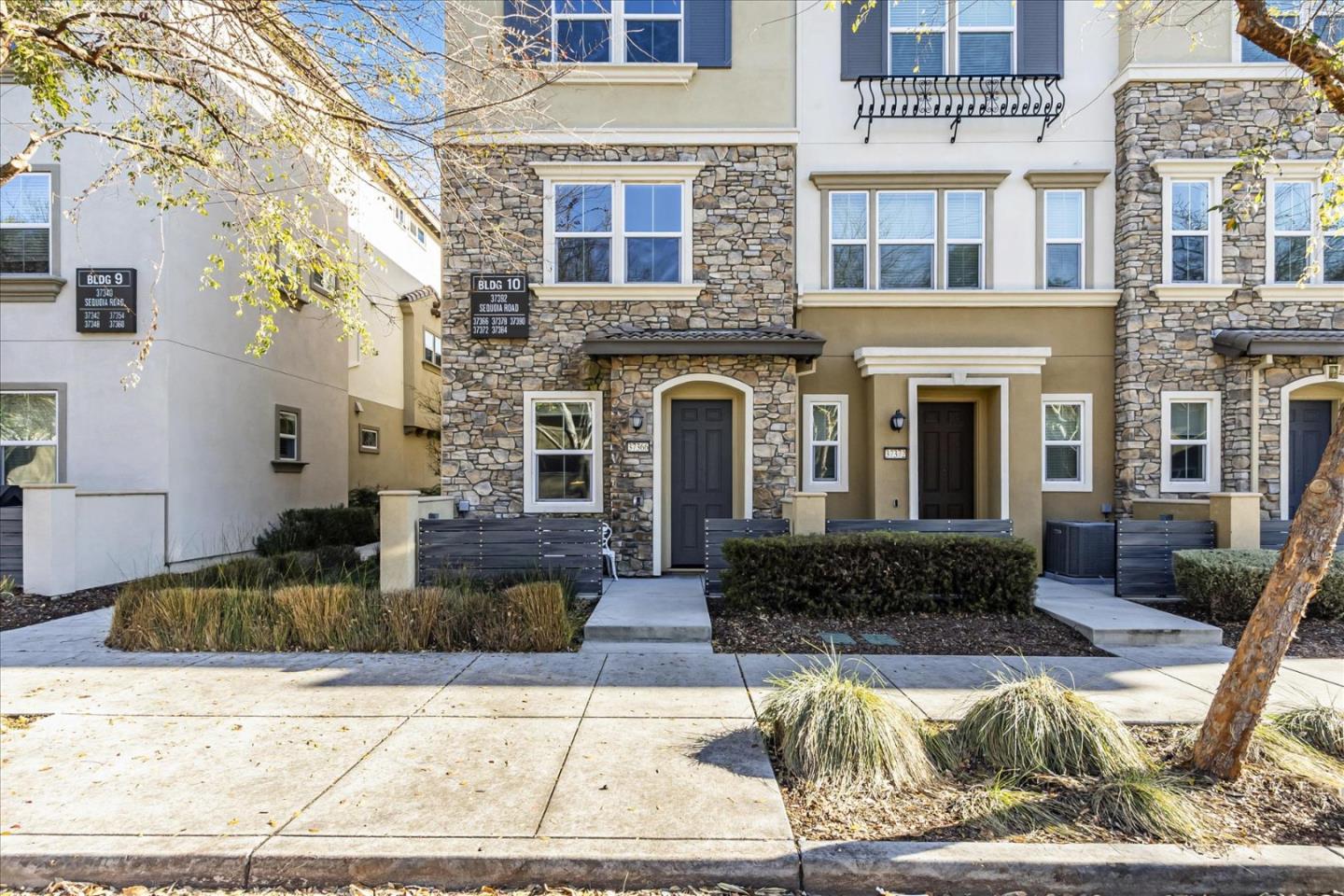 37366 Sequoia Road Fremont, CA 94536 - Photo 2 of 32 a view of a brick house with couches chairs