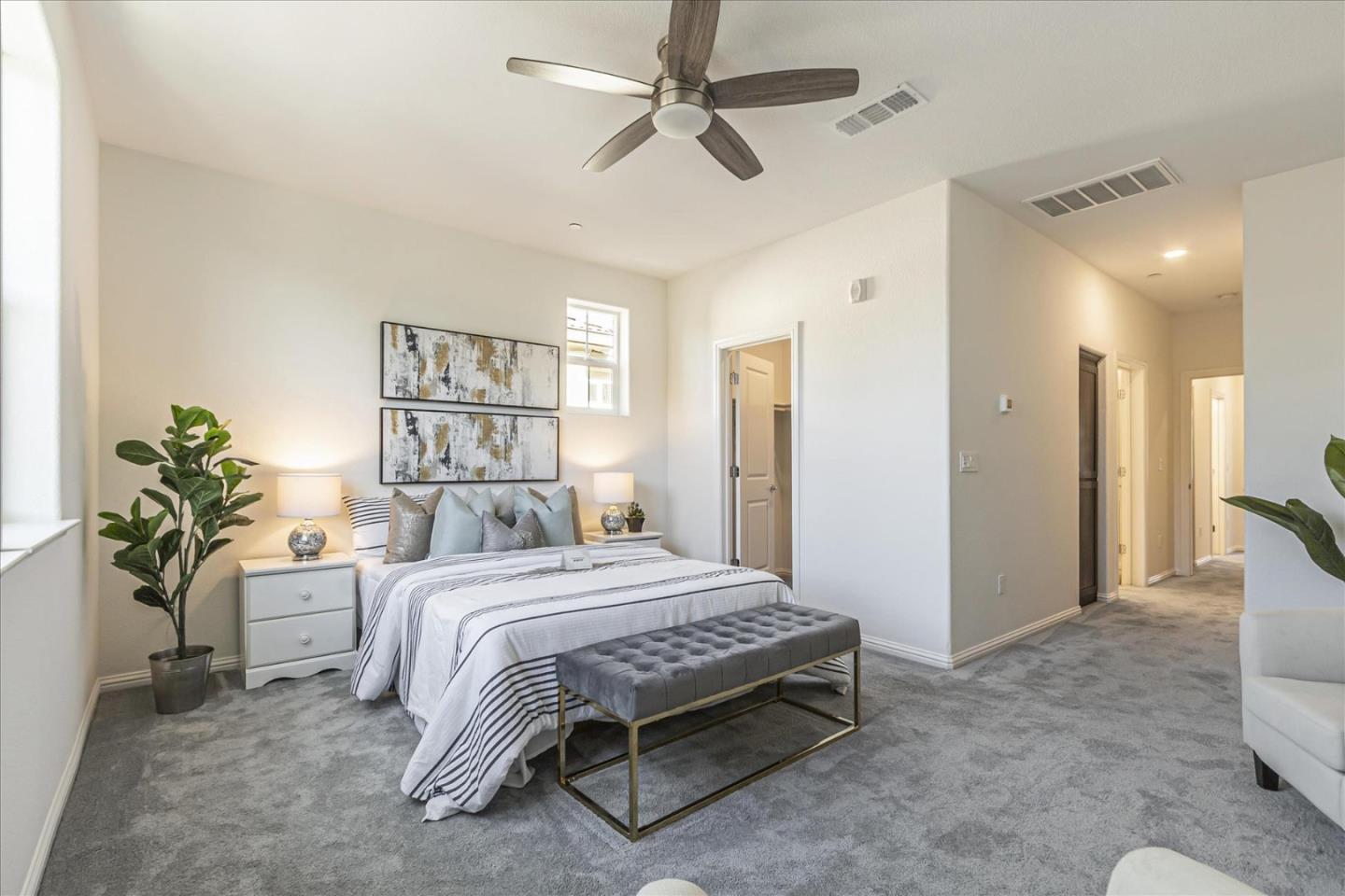 37366 Sequoia Road Fremont, CA 94536 - Photo 21 of 32 a bedroom with a bed dresser and a chandelier