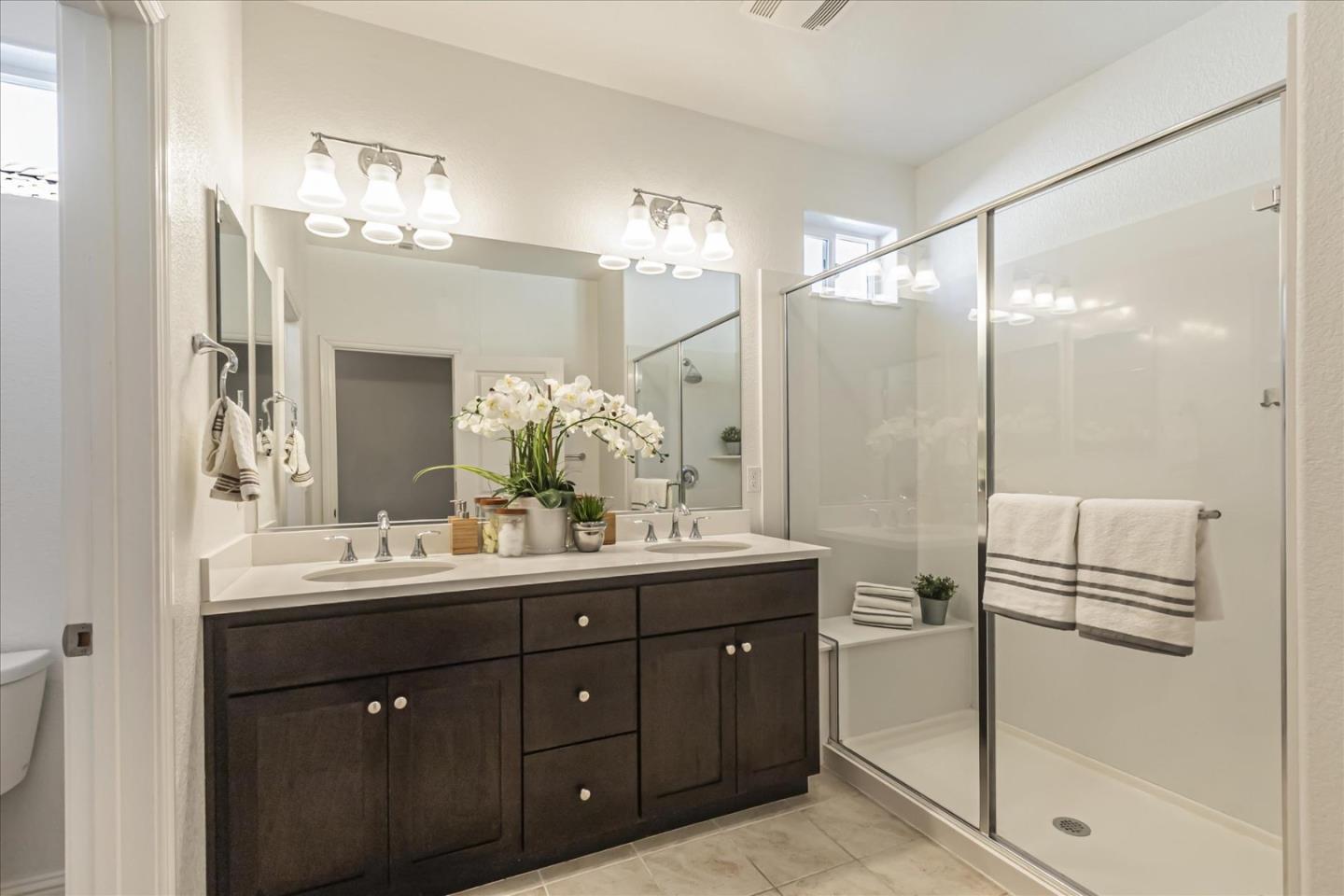 37366 Sequoia Road Fremont, CA 94536 - Photo 23 of 32 a bathroom with a double vanity sink mirror and double