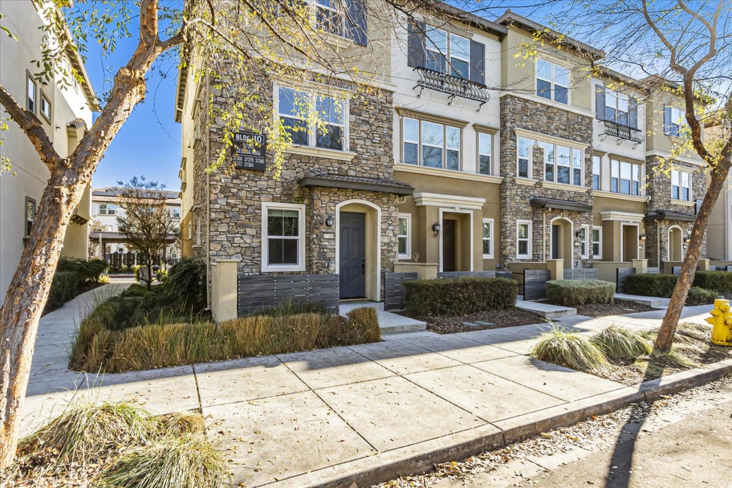 37366 Sequoia Road Fremont, CA 94536 - Photo 3 of 32 a view of a building with many windows