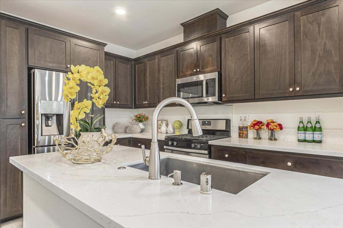 37366 Sequoia Road Fremont, CA 94536 - Photo 7 of 32 a kitchen with stainless steel appliances kitchen island granite countertop a sink and a counter top space