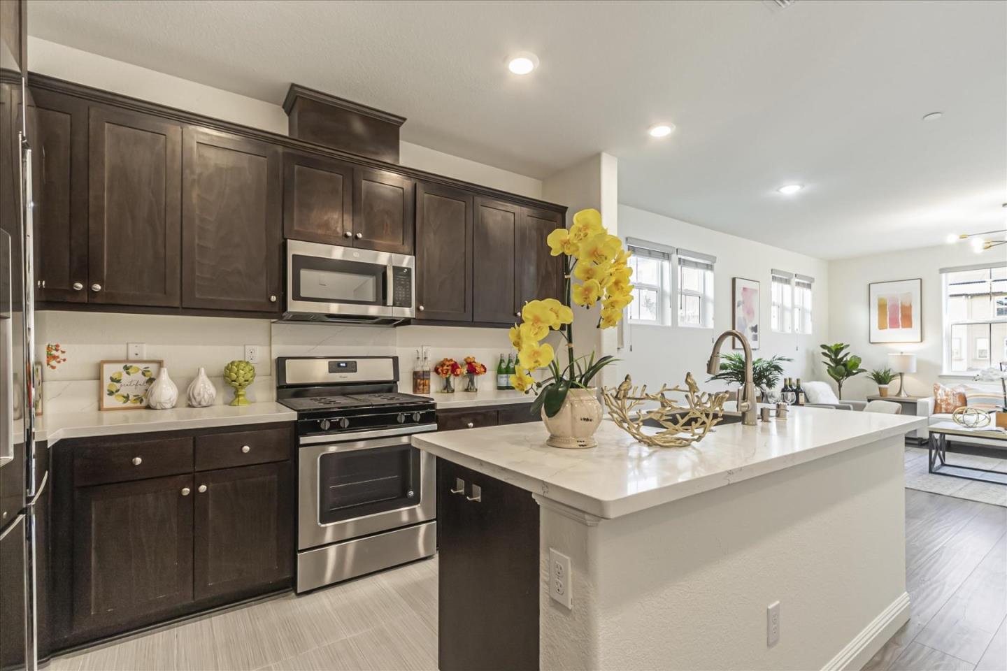 37366 Sequoia Road Fremont, CA 94536 - Photo 8 of 32 a kitchen with a sink cabinets and stainless steel appliances