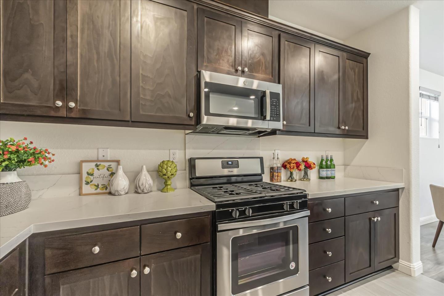 37366 Sequoia Road Fremont, CA 94536 - Photo 9 of 32 a kitchen with granite countertop cabinets stainless steel appliances and wooden floor