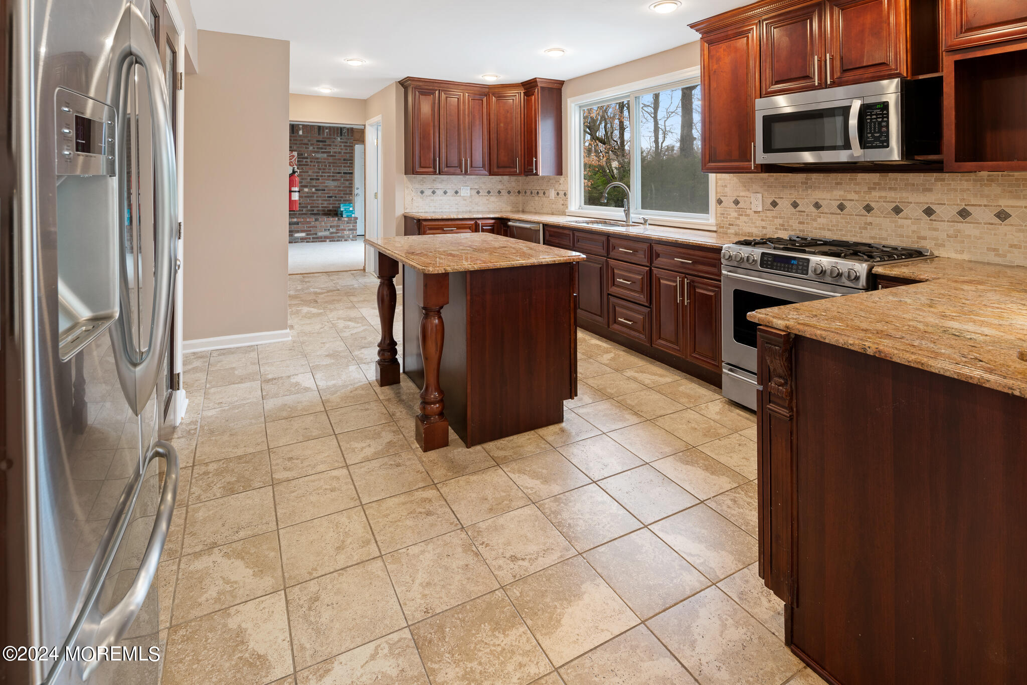 362 Elton Adelphia Road Freehold, NJ 07728 - Photo 16 of 38 a kitchen with stainless steel appliances granite countertop a stove a sink and a refrigerator
