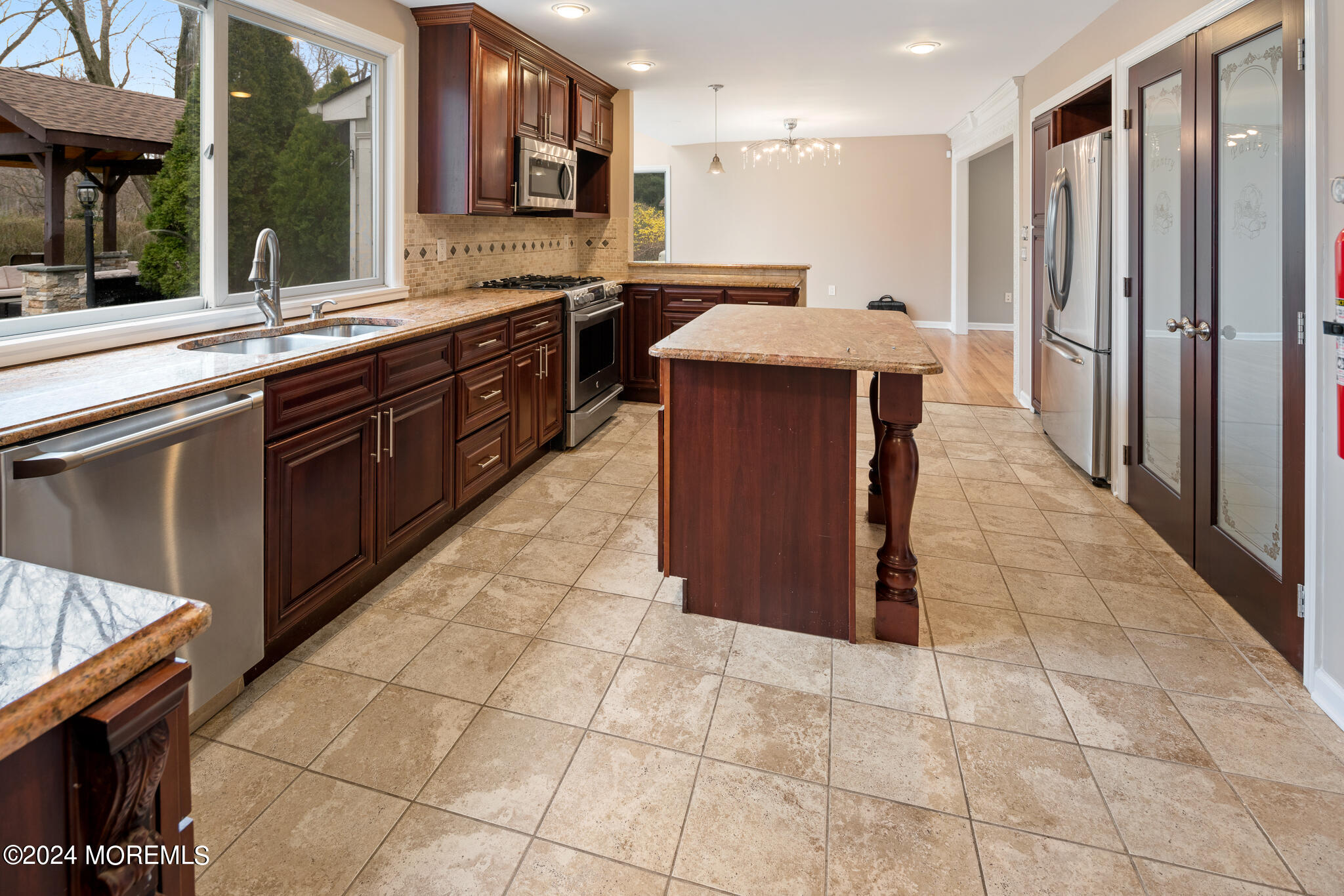 362 Elton Adelphia Road Freehold, NJ 07728 - Photo 17 of 38 a kitchen with stainless steel appliances granite countertop a stove a sink and a refrigerator