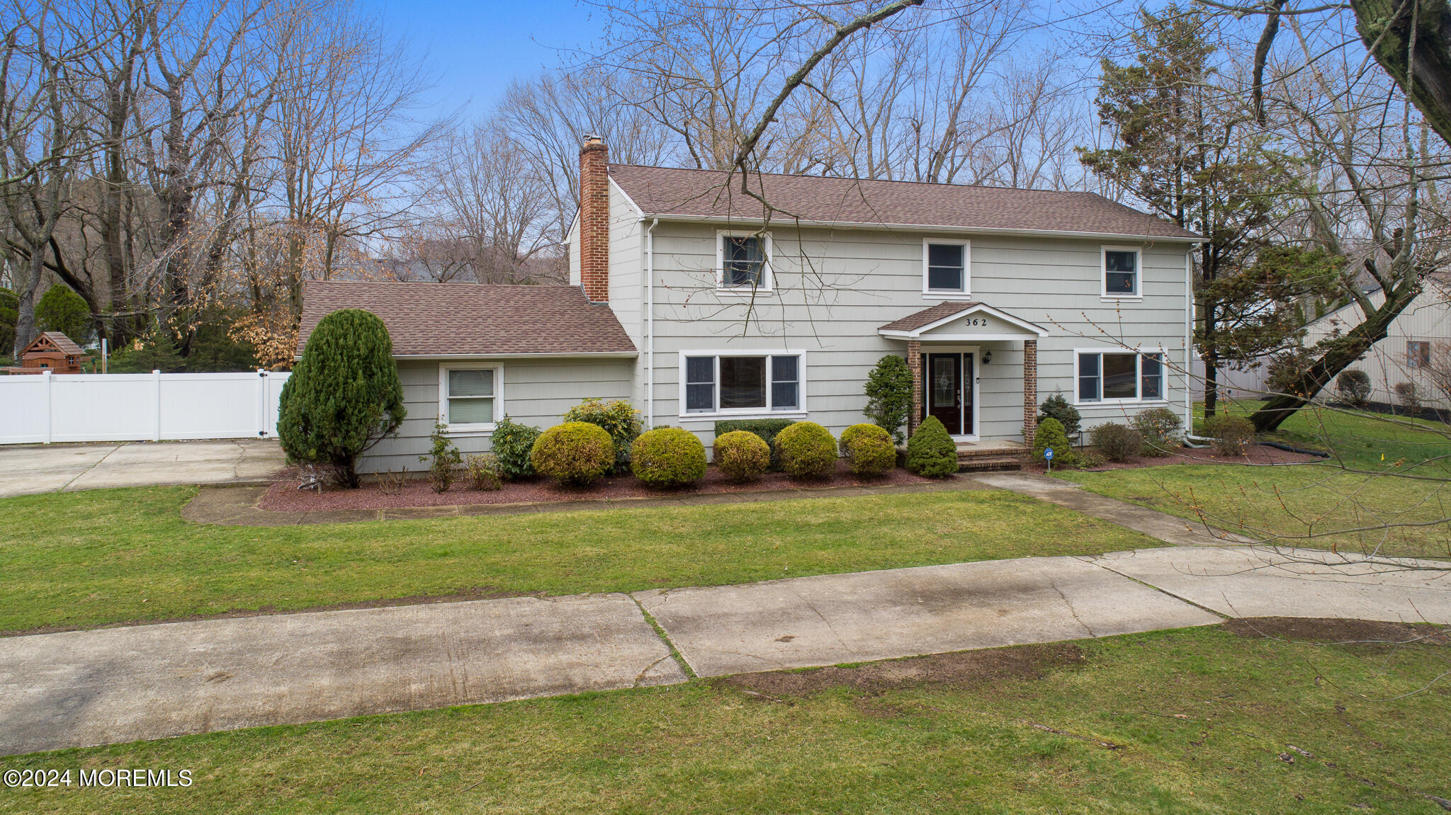 362 Elton Adelphia Road Freehold, NJ 07728 - Photo 3 of 38 a front view of a house with a yard and trees