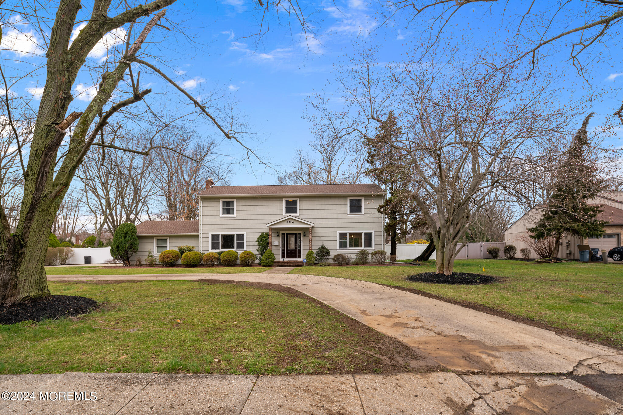 362 Elton Adelphia Road Freehold, NJ 07728 - Photo 4 of 38 a front view of a building with a yard