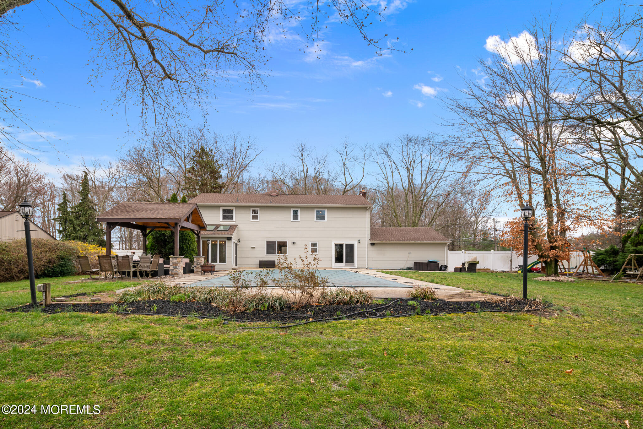 362 Elton Adelphia Road Freehold, NJ 07728 - Photo 8 of 38 a front view of a building with a yard