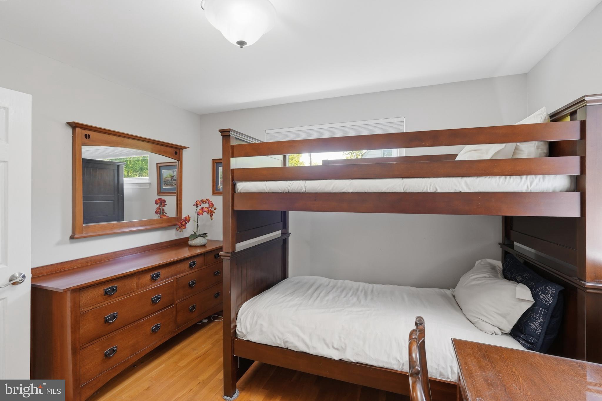 7006 Barnack Drive Springfield, VA 22152 - Photo 20 of 56 a bedroom with a bed and a dresser