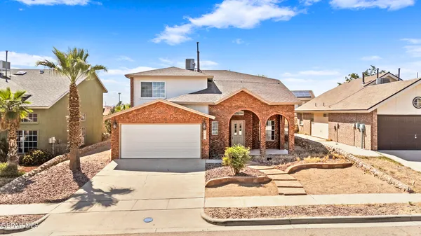 a front view of a house with a garage
