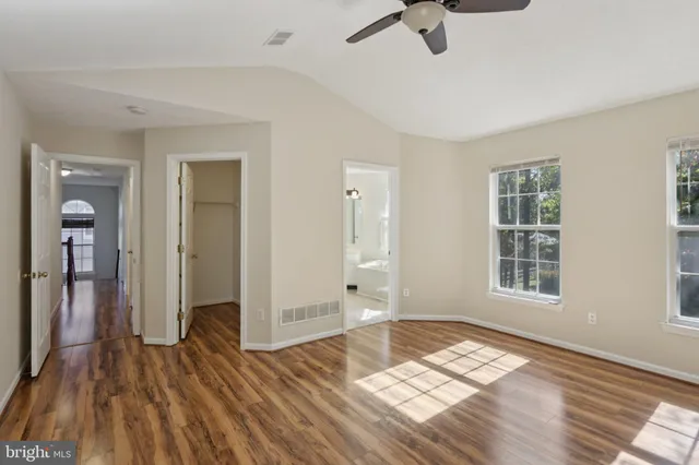 a white bath tub sitting next to a window
