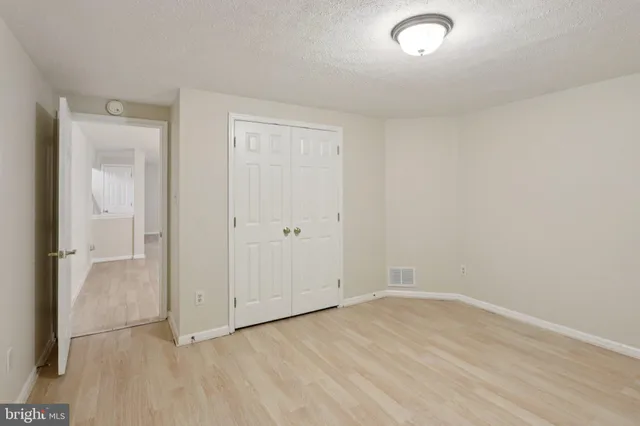 a view of balcony with wooden floor and fence
