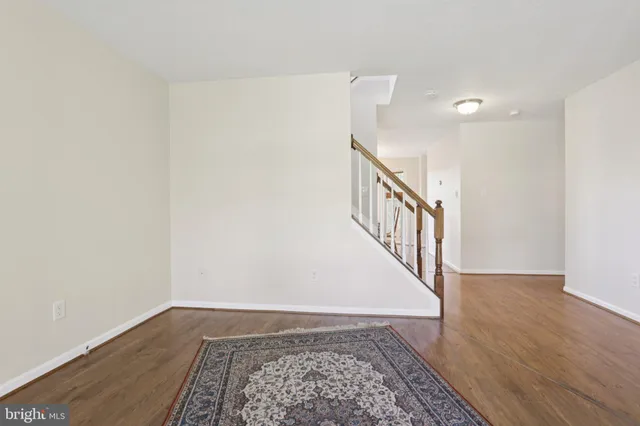 a view of a dining room with furniture wooden floor and chandelier