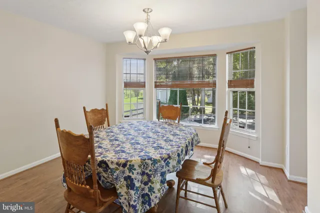 a very nice looking dining room with a table and chairs