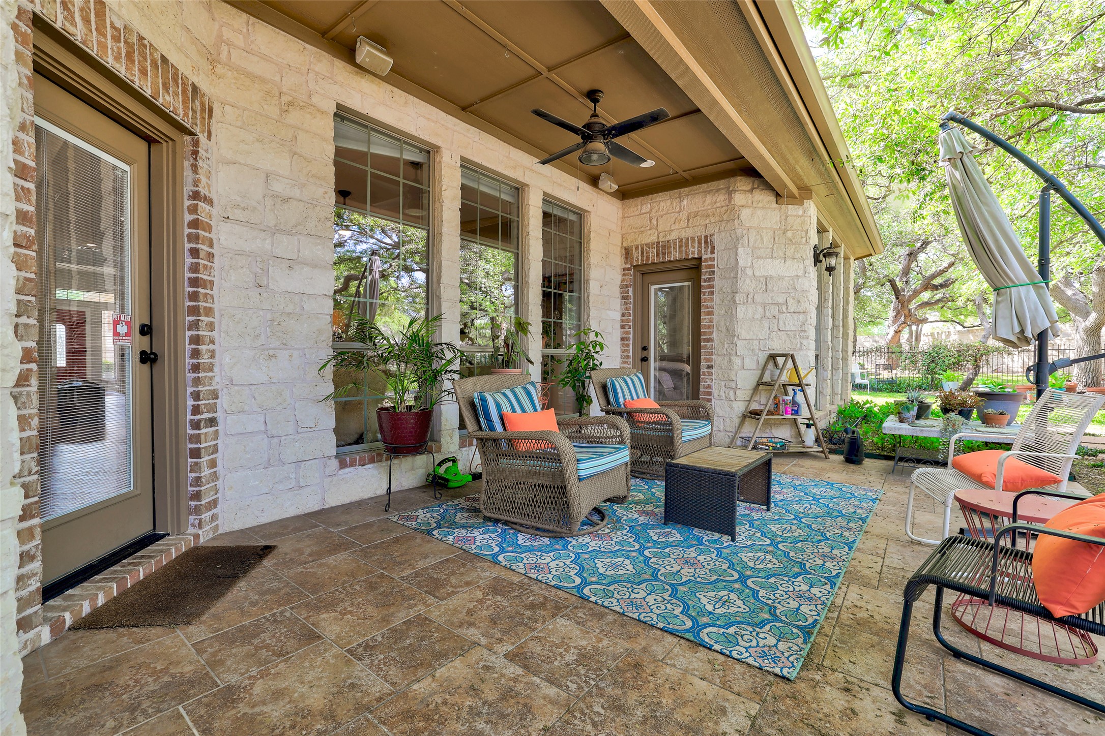 805 Boquilla Trail Georgetown, TX 78633 - Photo 32 of 40 a view of patio with couches table and chairs and potted plants
