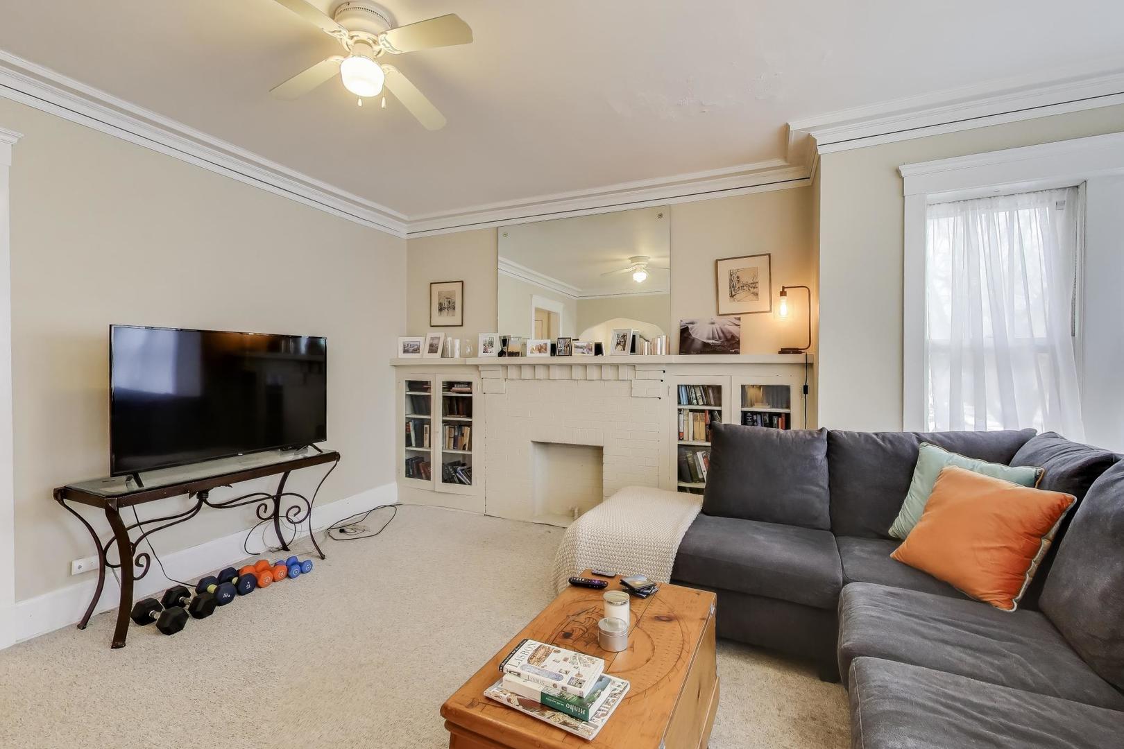 2245 West Giddings Street Chicago, IL 60625 - Photo 19 of 50 a living room with furniture and a flat screen tv