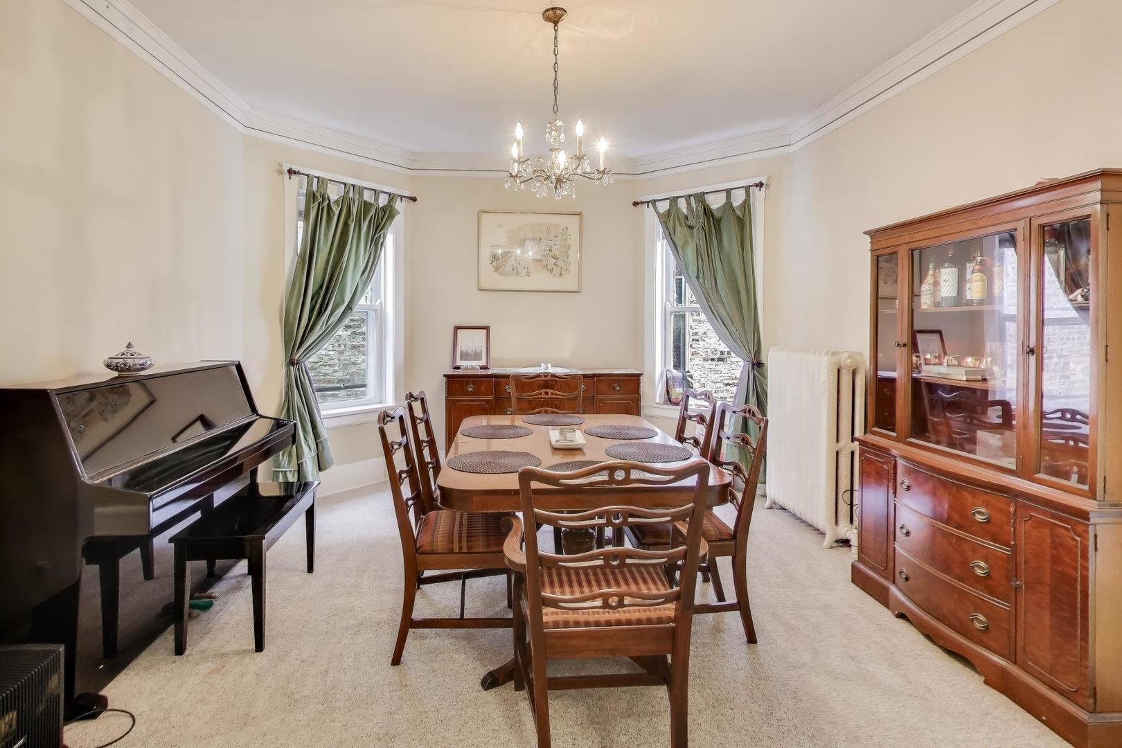 2245 West Giddings Street Chicago, IL 60625 - Photo 23 of 50 a view of a dining room with furniture and a chandelier