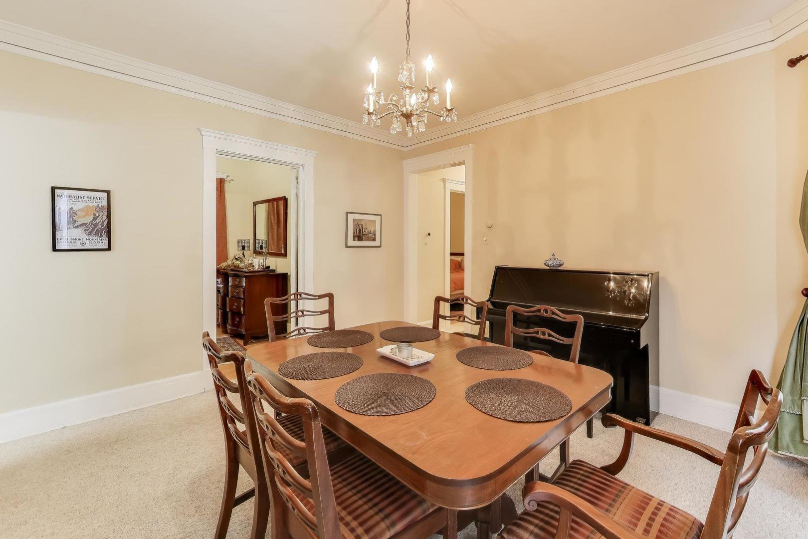 2245 West Giddings Street Chicago, IL 60625 - Photo 24 of 50 a view of a dining room with furniture and chandelier