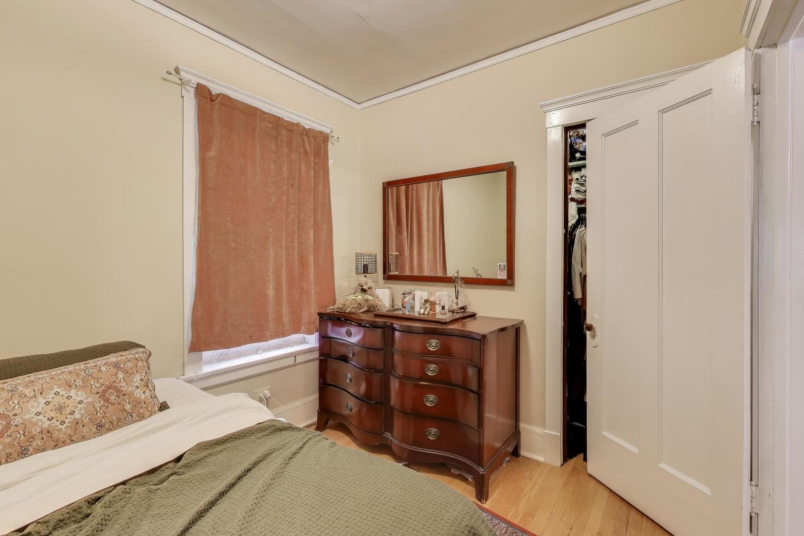 2245 West Giddings Street Chicago, IL 60625 - Photo 33 of 50 a bedroom with a bed and wooden floor