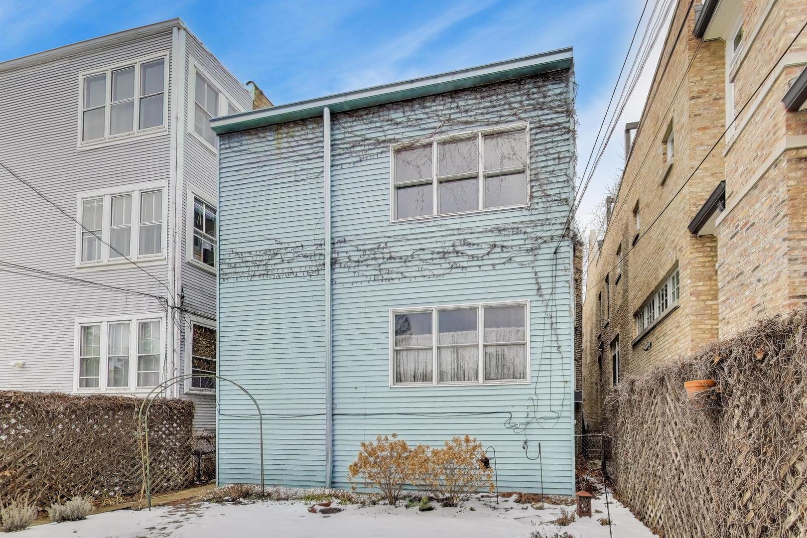 2245 West Giddings Street Chicago, IL 60625 - Photo 41 of 50 a front view of a house with brick walls