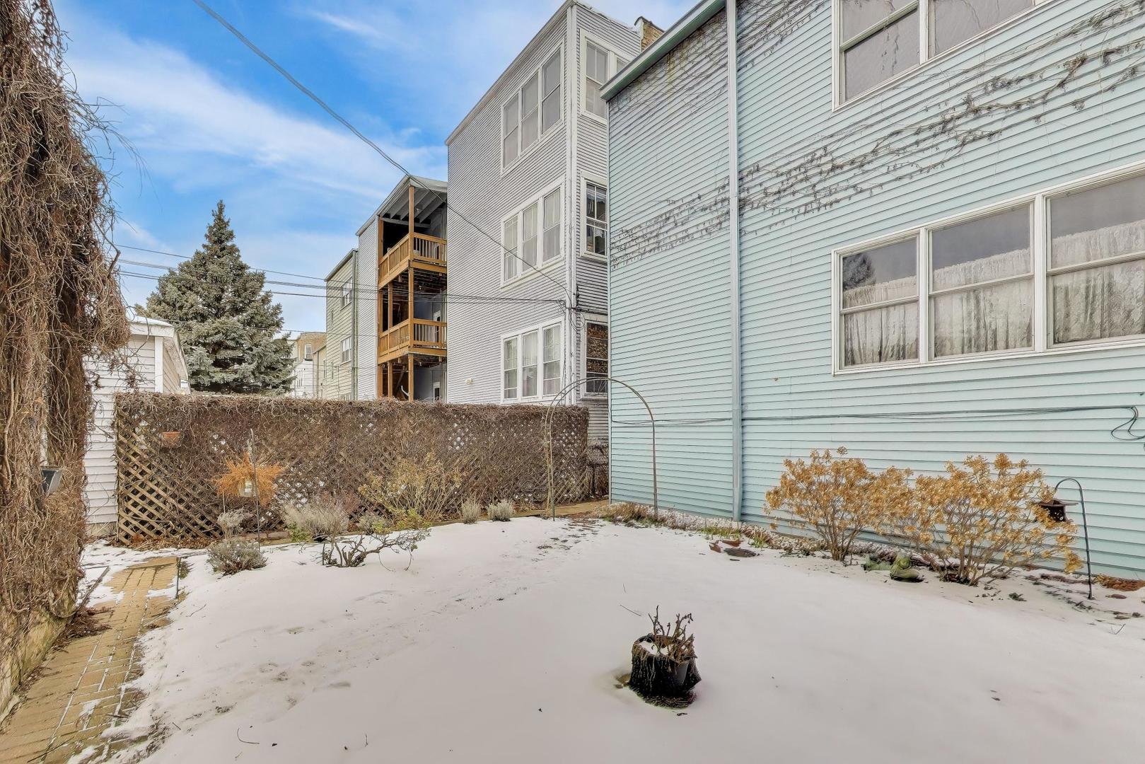 2245 West Giddings Street Chicago, IL 60625 - Photo 43 of 50 a view of a house with a snow
