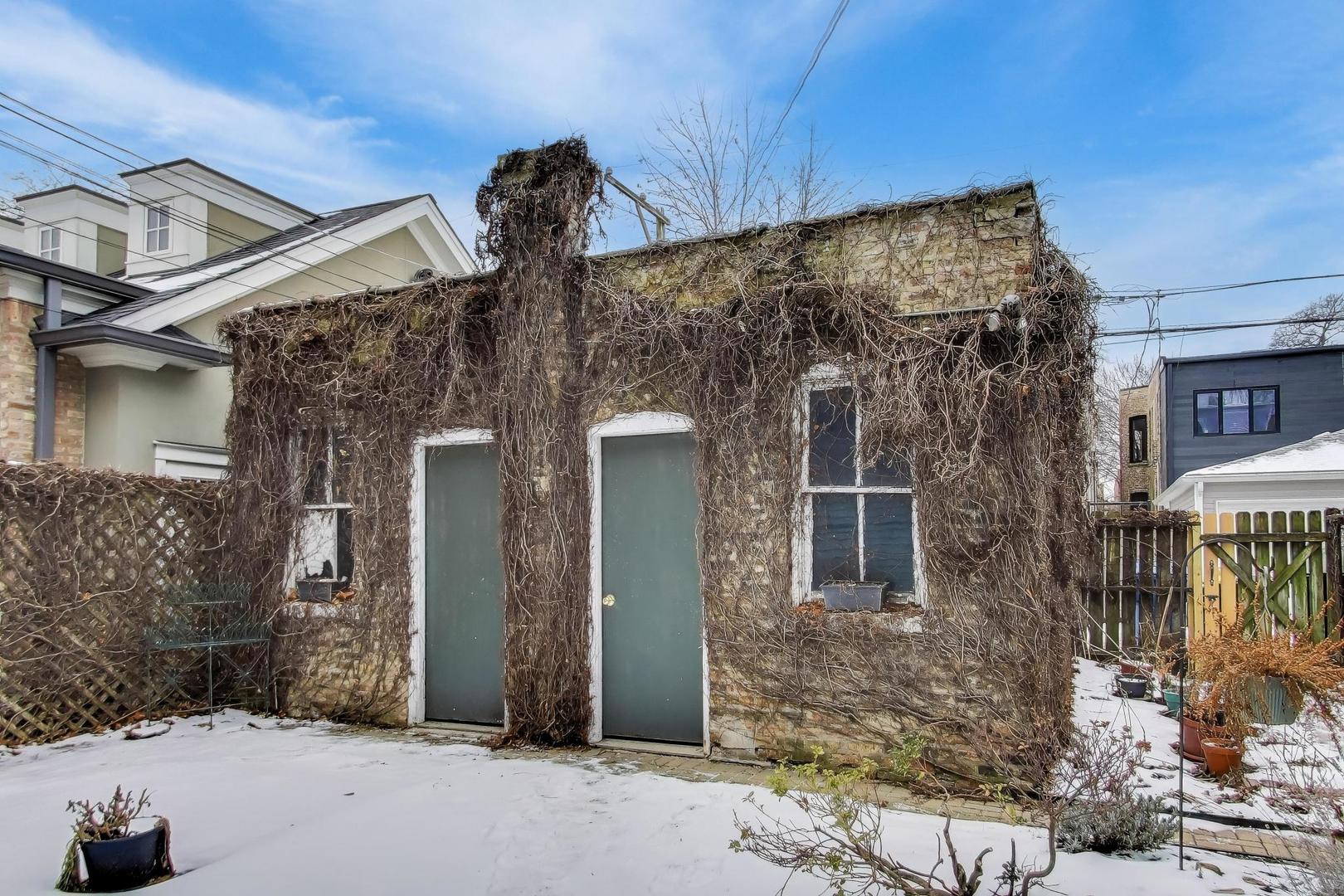 2245 West Giddings Street Chicago, IL 60625 - Photo 45 of 50 a front view of a house with parking space